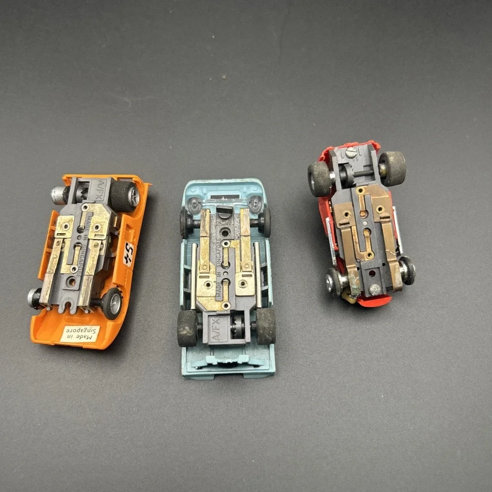AURORA MCLAREN  AFX RARE TEAL BLUE #54  & YELLOW FERRARI CAN AM HO SLOT CAR #15